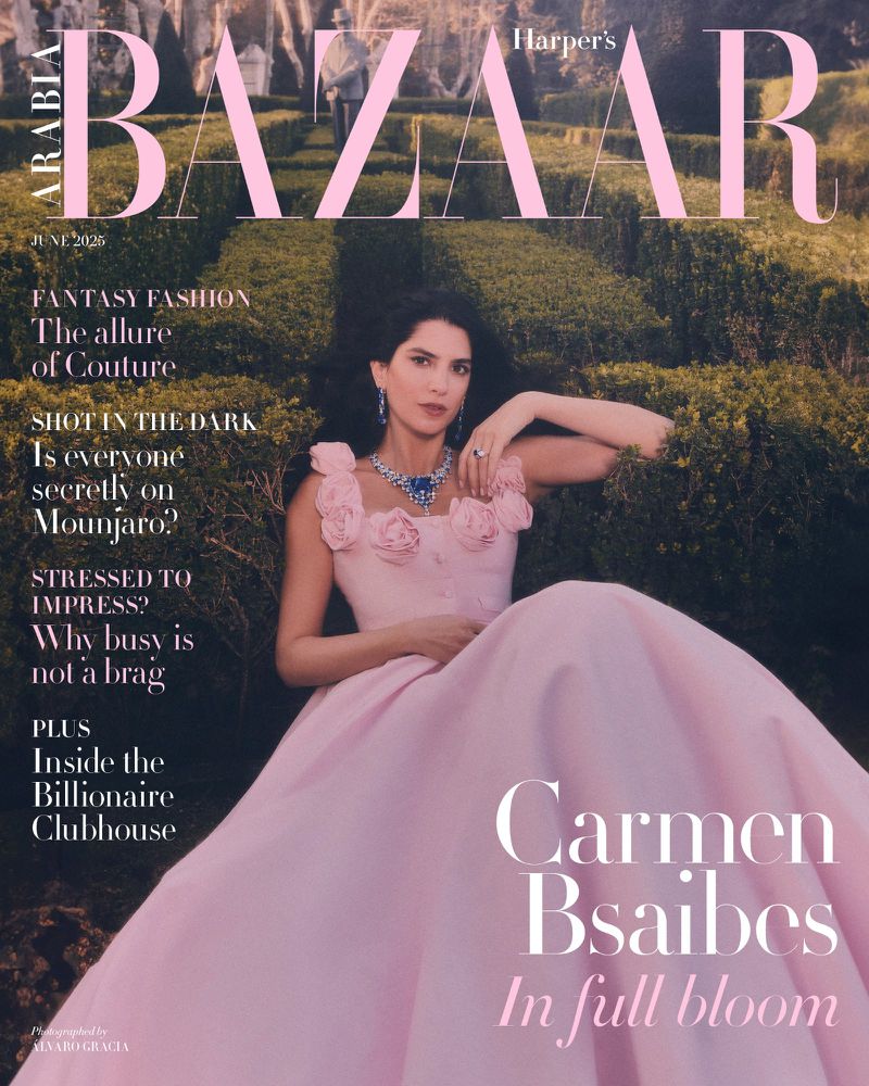 Harper's Bazaar cover with Carmen Bsaibes in a pink gown in a garden setting, June 2020 issue. Elegant fashion and outdoor photography.