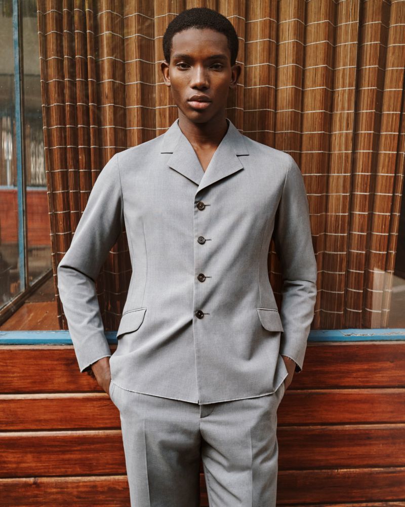 Model Ibra Niakate wearing a grey suit jacket for Farfetch Lookbook S/S 26