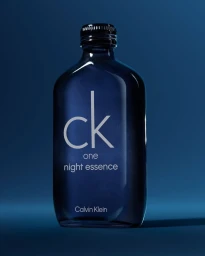 Dark blue glass perfume bottle featuring white branding typography centered against a matching blue background