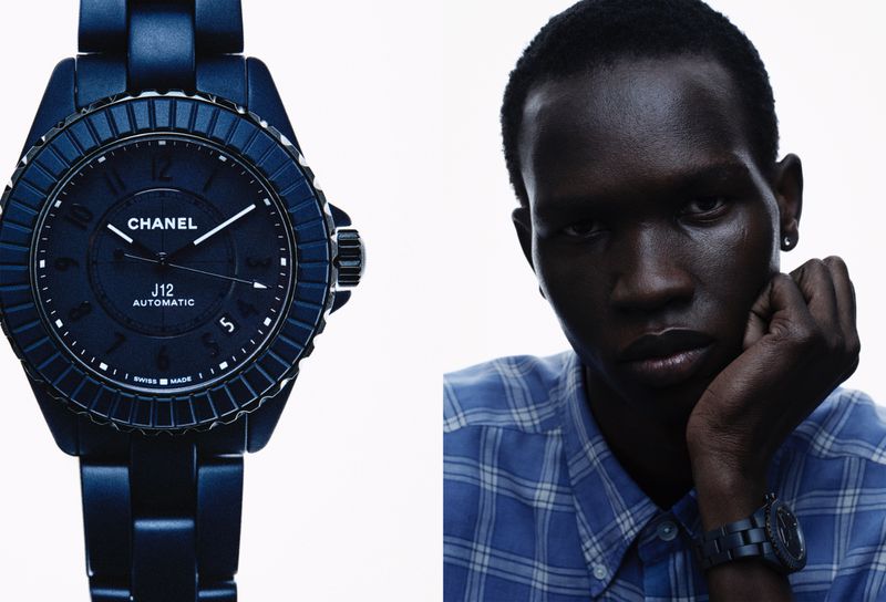 Close-up of a blue Chanel J12 automatic watch alongside a dark-skinned male model wearing the same watch and blue plaid shirt.