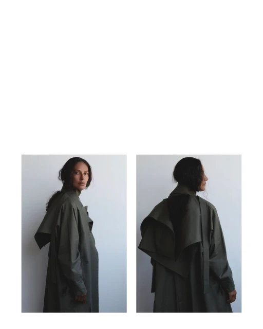Studio shot of a woman in a green trench coat, from both front and back. Minimalist fashion, soft lighting, clean aesthetic.