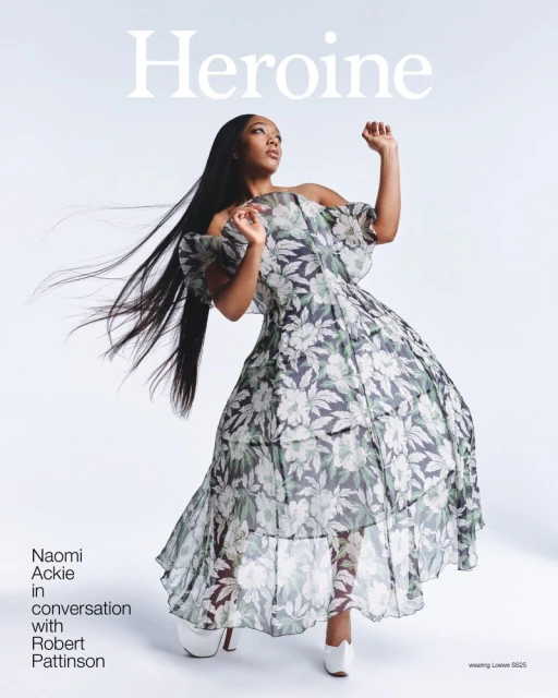 Magazine cover featuring Naomi Ackie in a floral off-the-shoulder gown with long dark hair, against a pale background with magazine title.