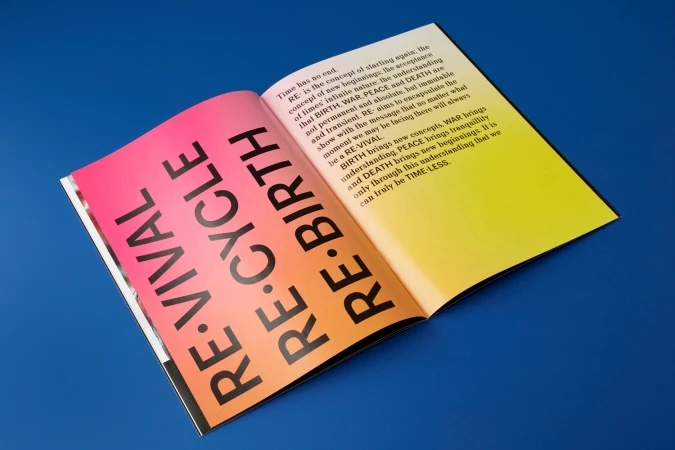 Open publication spread featuring bold typography on gradient pink, orange, and yellow pages set against a vibrant blue background.