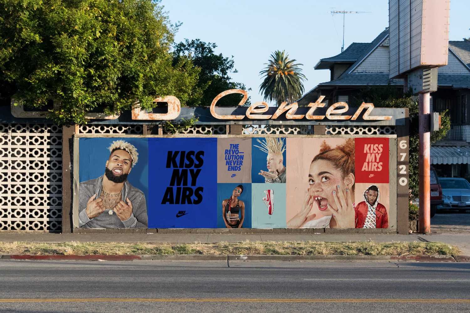 Nike Kiss My Airs billboard displayed on a weathered exterior wall with graphic posters featuring Odell Beckham Jr.