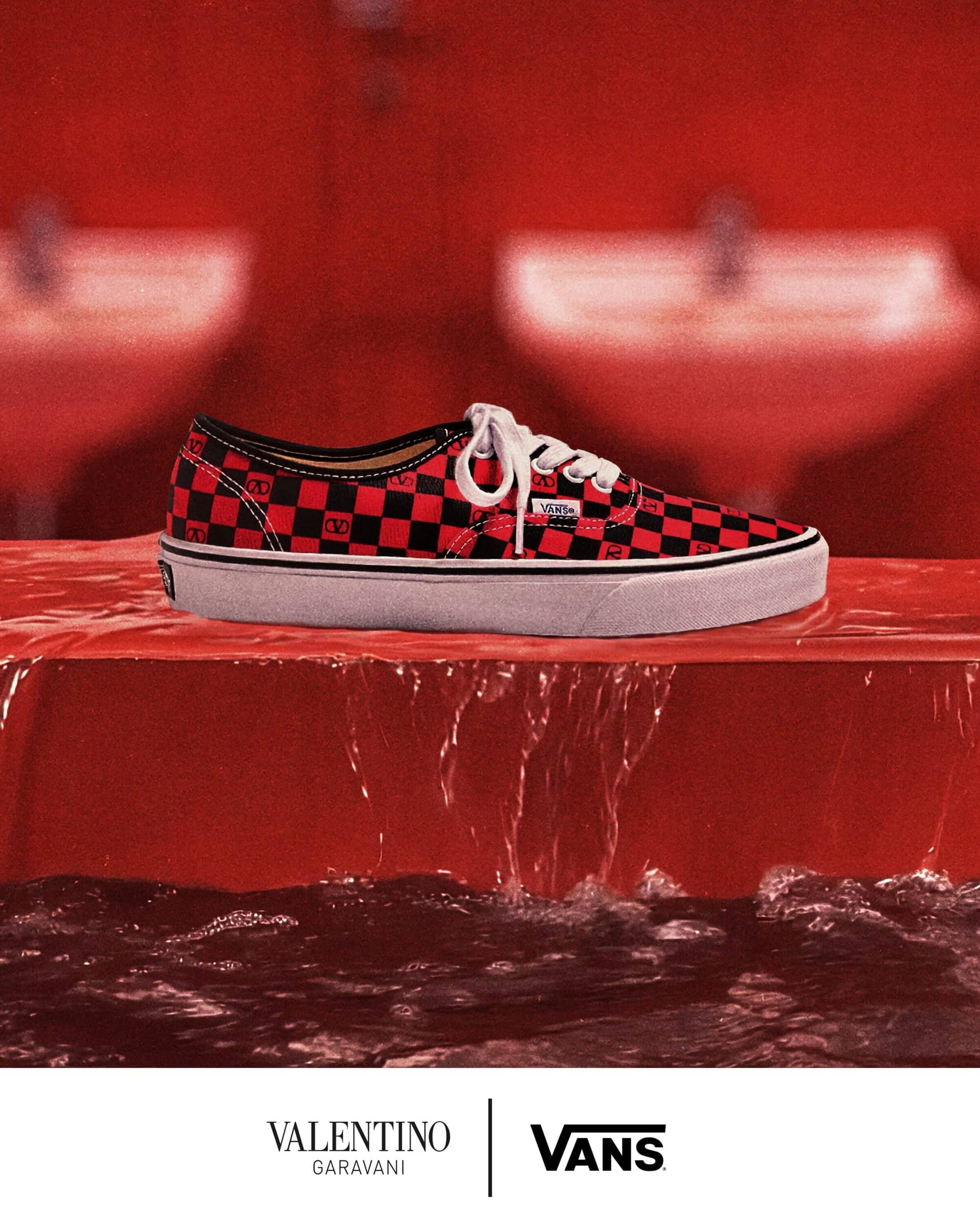 Valentino Garavani and Vans checkered sneaker on a wet red surface with water trickling down