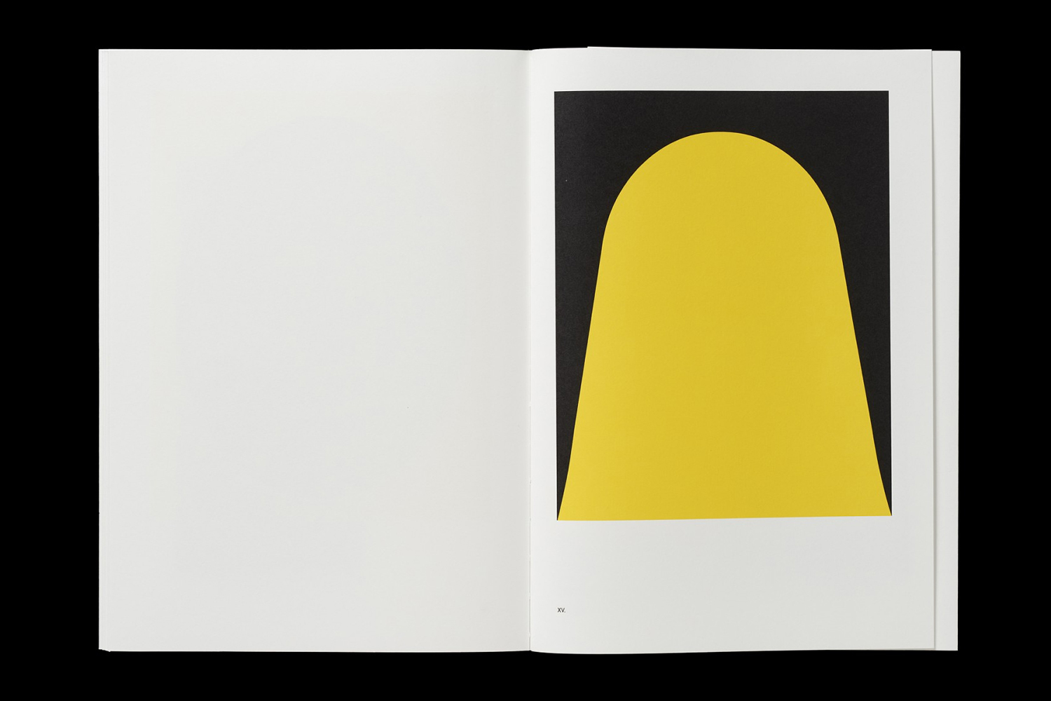 Open book spread showing a white page on the left and a black rectangular plate with a bold yellow arch shape on the right