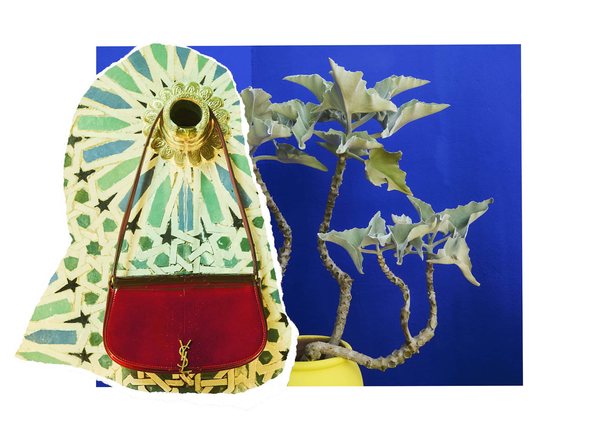 Red leather handbag hanging against patterned tile and a potted plant with a blue wall background