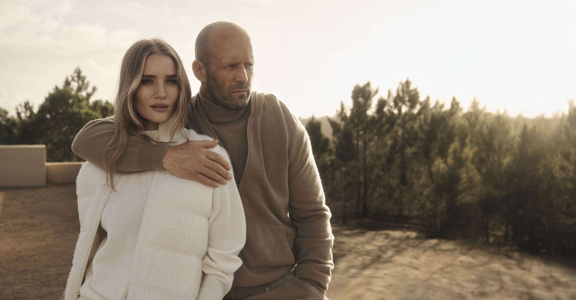 Rosie Huntington-Whiteley and Jason Statham outdoors for the Falconeri Fall 2025 ad campaign in warm sunlight