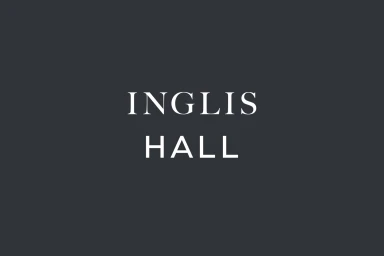 Dark grey graphic design brand identity logo featuring white serif typography for Inglis Hall