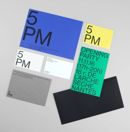 Flat lay of brand identity items for 5PM including blue, yellow, white, grey, and green stationery with bold typography.