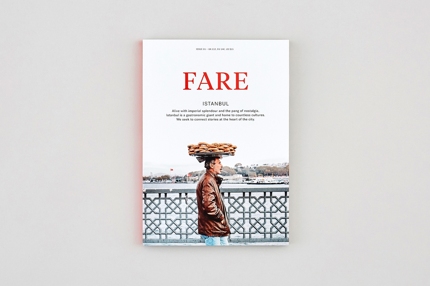 FARE magazine issue cover featuring a man in a brown leather jacket carrying a tray of bread on his head against an Istanbul backdrop.