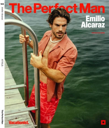 Magazine cover features a man in an open red shirt and red shorts standing in water, next to a metal ladder, looking away from the camera.