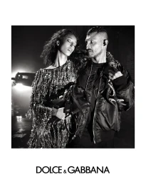 Black and white portrait of a woman in a sequined dress and a man in a bomber jacket for Dolce and Gabbana