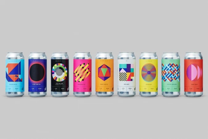 Line-up of nine silver beverage cans featuring colourful geometric label designs against a neutral grey background