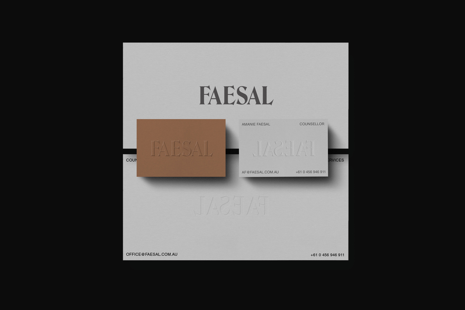 Minimalist brand identity layout featuring Faesal business cards with embossed typography against a neutral background.