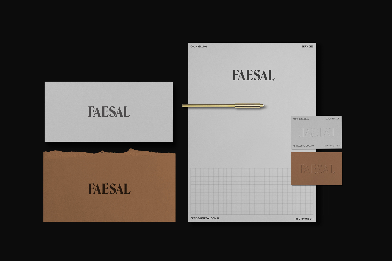 Faesal brand identity stationary mockup featuring letterhead, business cards, and a brass pen on dark background.