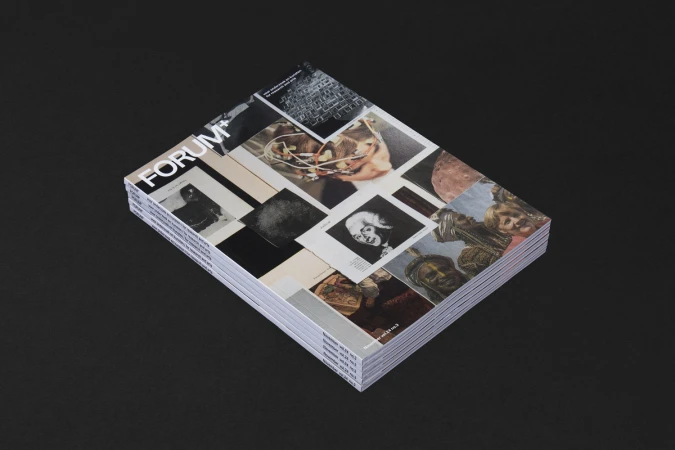 A stack of FORUM+ magazines featuring collage covers rests on a dark surface, designed by Vrints-Kolsteren for Brand Identity.