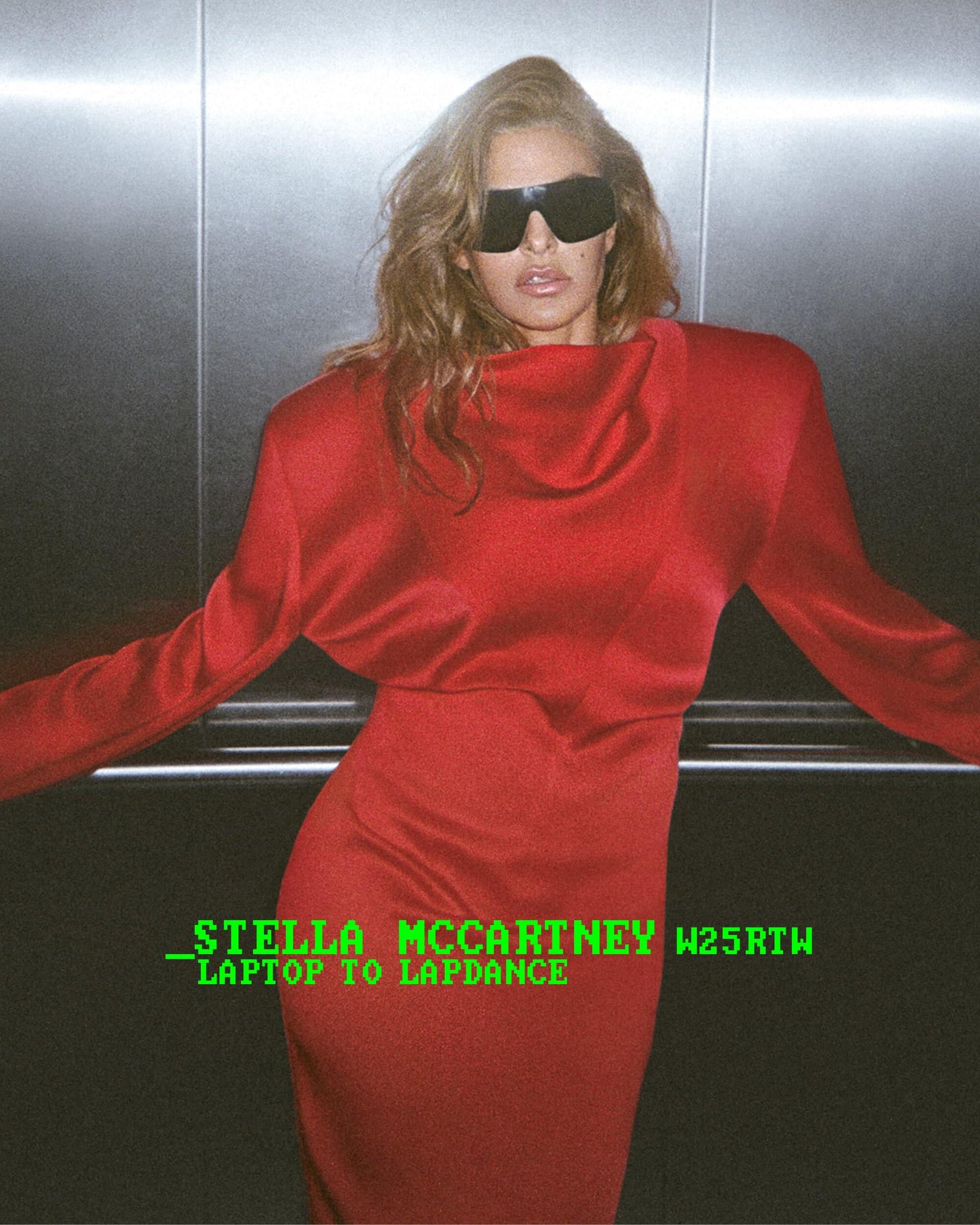 Model wearing a red dress and dark sunglasses inside a metallic elevator for Stella McCartney
