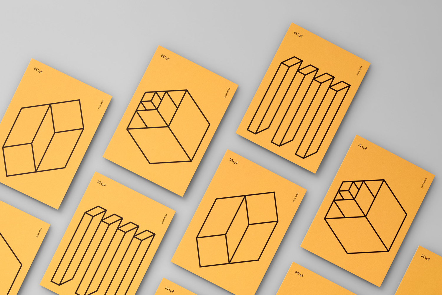 Multiple yellow brand identity cards featuring geometric line art arranged on a neutral grey background.