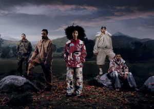 Five models posing outdoors in autumn landscape wearing KidSuper Fall 2025 collection apparel