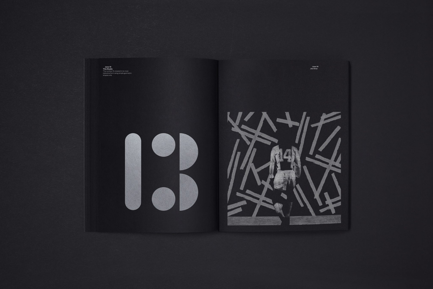 Open black catalog showing large silver typography on the left page and a graphic illustration on the right.
