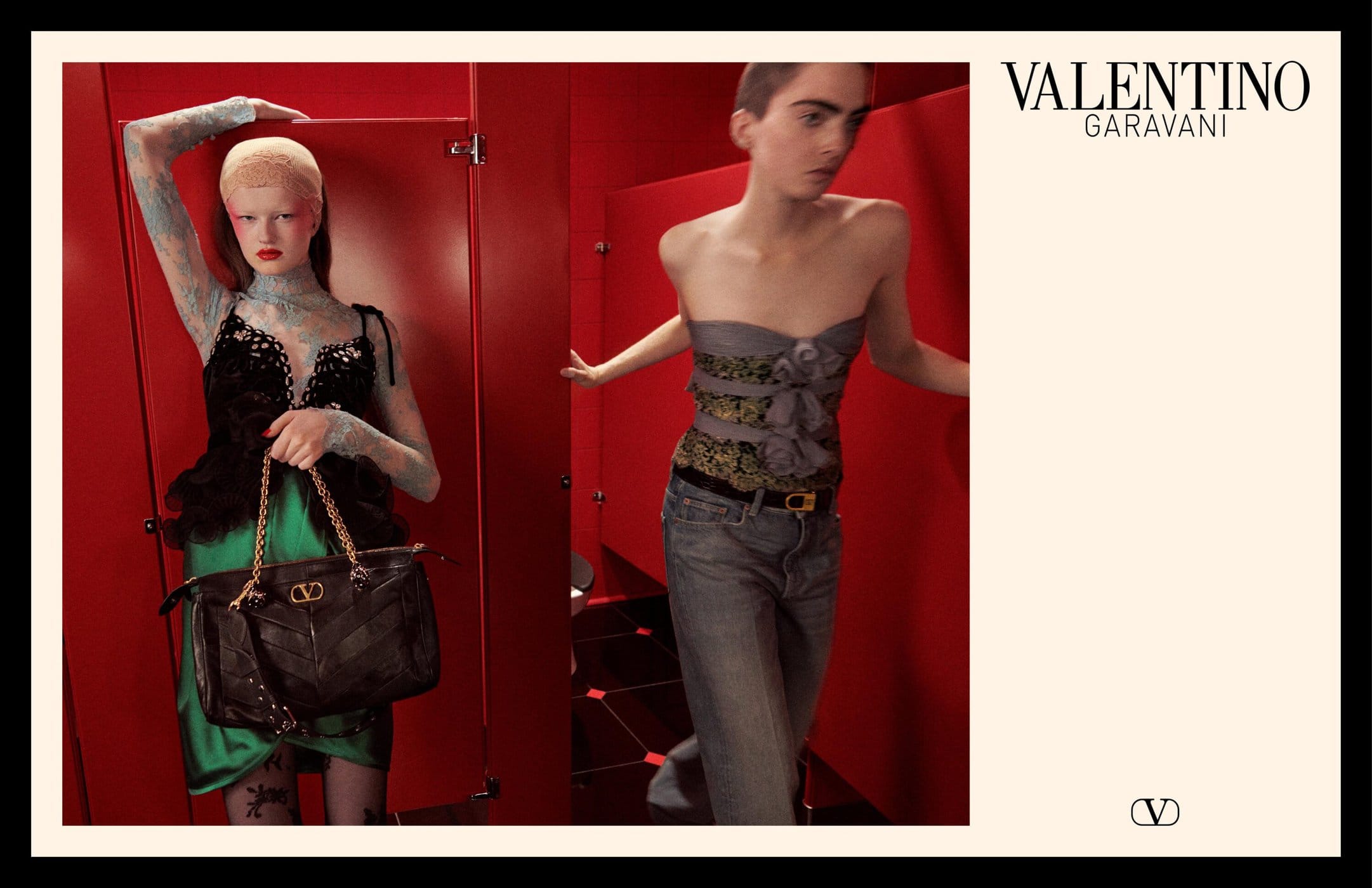 Two models in a red restroom setting, one holding a black handbag and wearing a black top with green skirt, the other in denim and strapless top