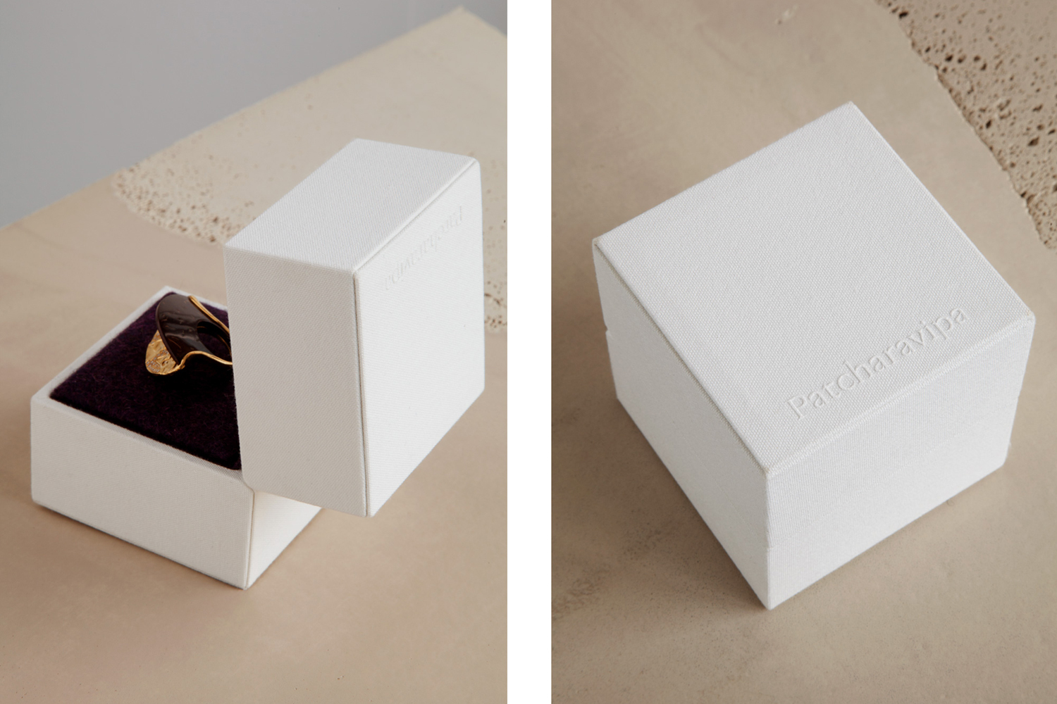 Two white textured jewelry boxes by Patcharavipa, one open showing a gold ring on a purple velvet insert.