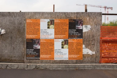Posters pasted on a plywood construction wall promoting Spazio Maiocchi founded by Carhartt WIP and Slam Jam