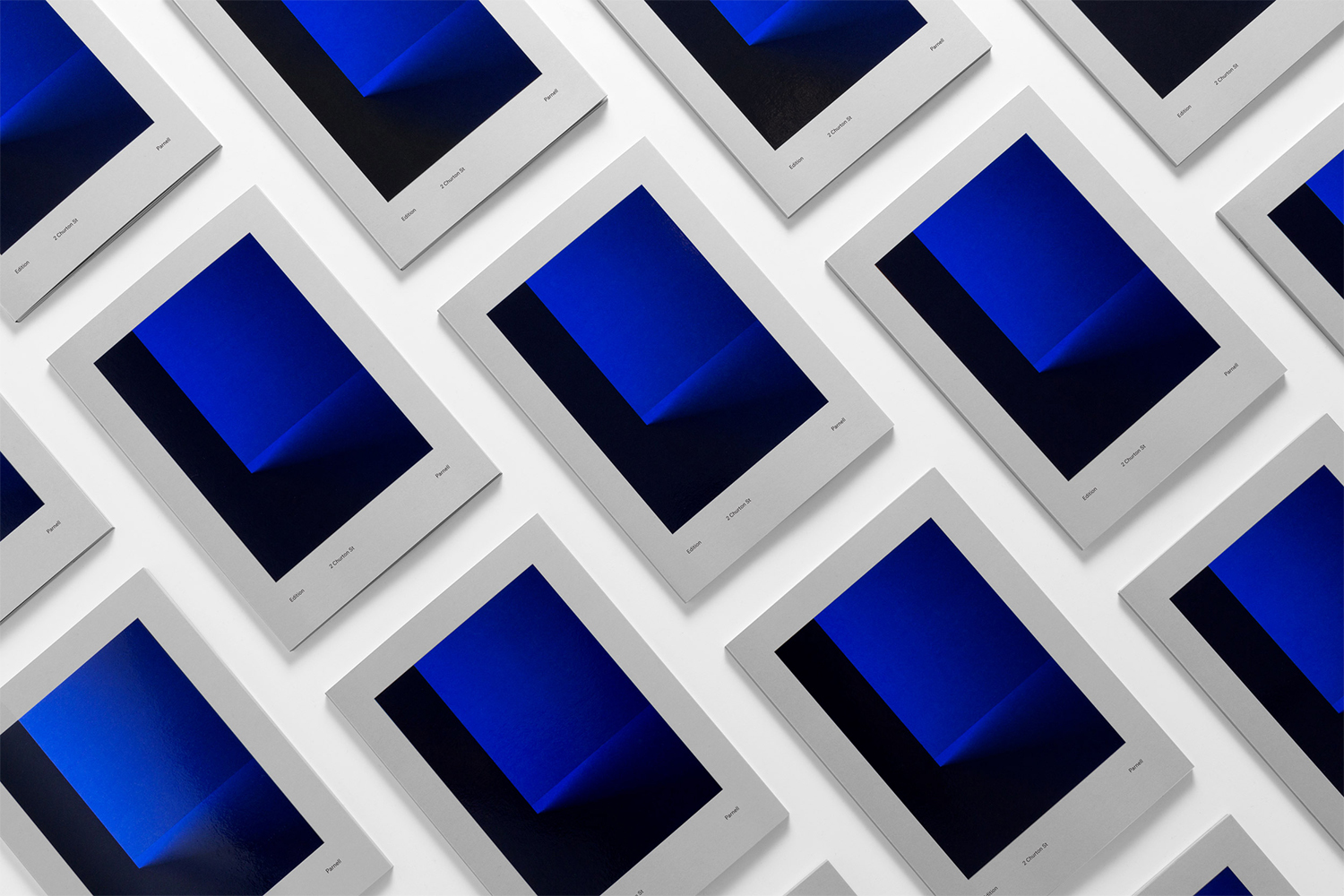 Multiple identical brochures arranged in a repeating diagonal grid pattern against a white background