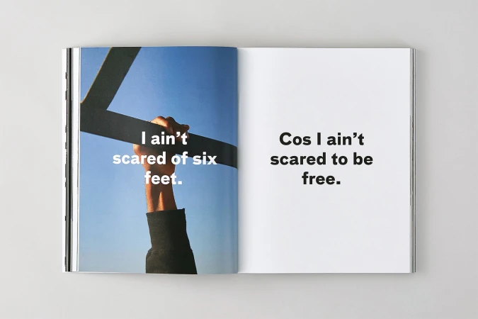 Spread of Brick Magazine showing a hand gripping a dark bar against a blue sky with bold text on both pages.