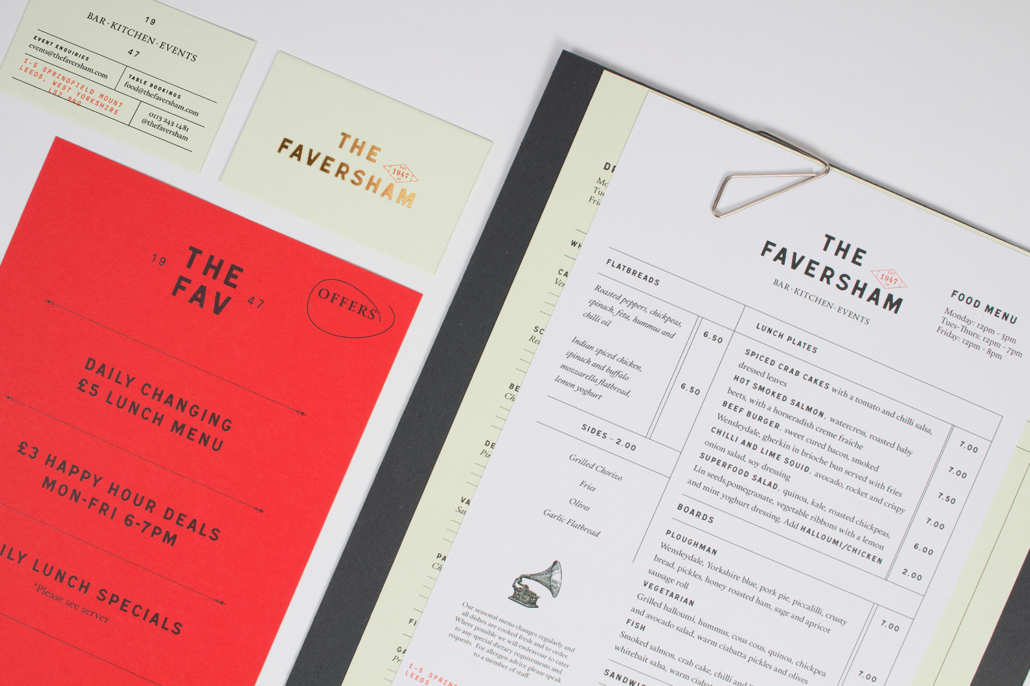 Flat lay of restaurant menus, business cards, and stationery for The Faversham on a clean white surface
