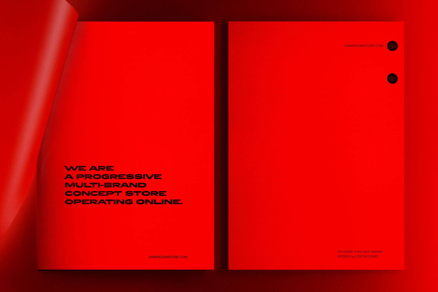 Red printed brand identity documents with black typography against a vivid red background