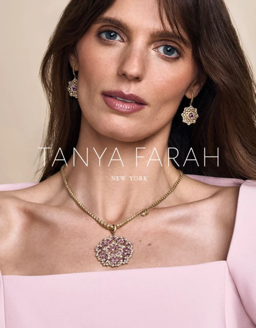 Close-up of a woman wearing a gold necklace with a flower pendant and matching earrings for Tanya Farah New York jewelry brand.