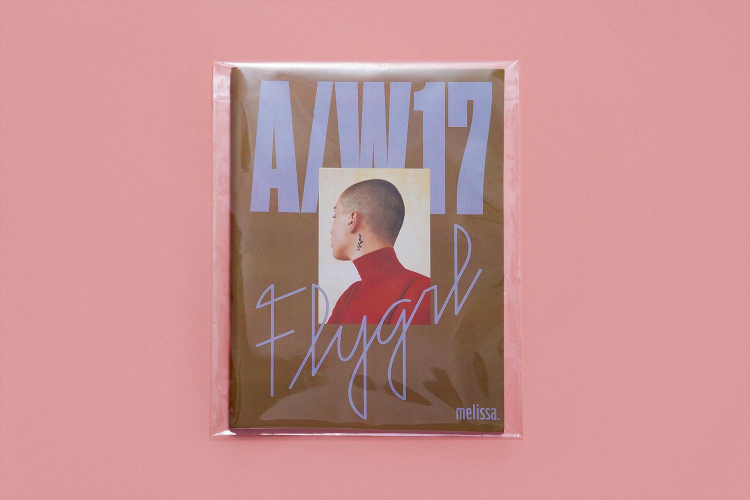 Packaged publication cover with text A/W 17 Flygirl and portrait inset on pink background