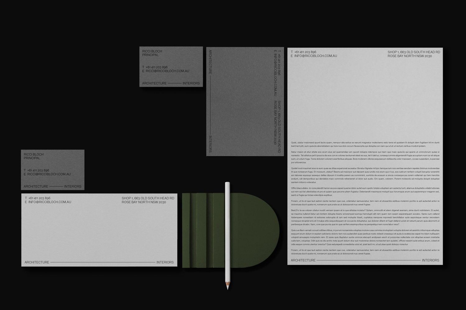 Minimalist corporate stationery branding layout featuring business cards, envelopes, letterhead, and a white pencil against a black background
