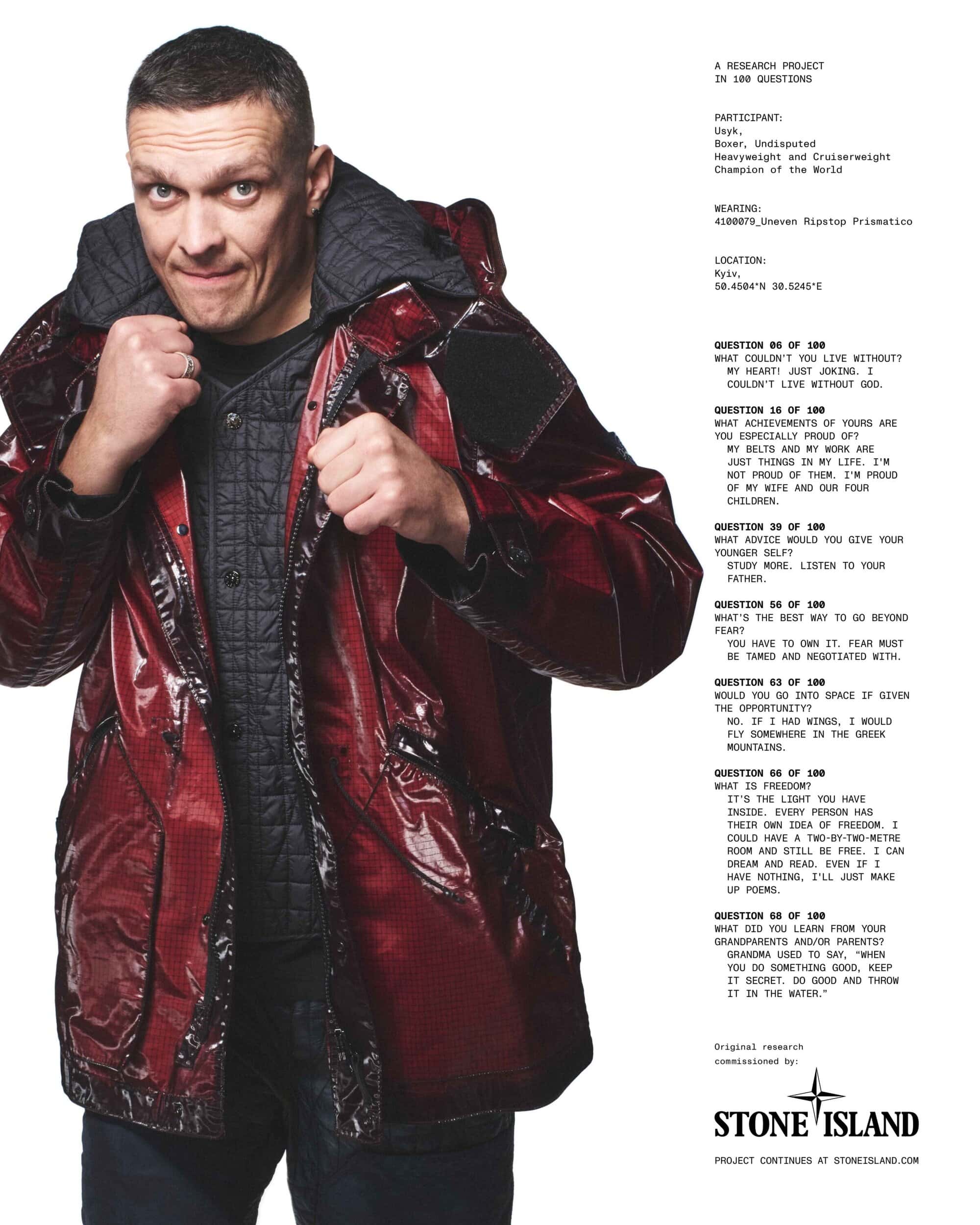 Oleksandr Usyk wearing a glossy red jacket against a white background for Stone Island Fall 2025 campaign.