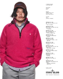 Man wearing a vibrant pink fleece jacket, grey trousers, and a brown cap against a white backdrop with text on the right