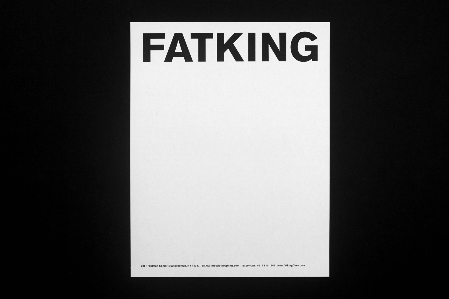 A minimal white poster featuring bold black FATKING typography centered against a dark background.