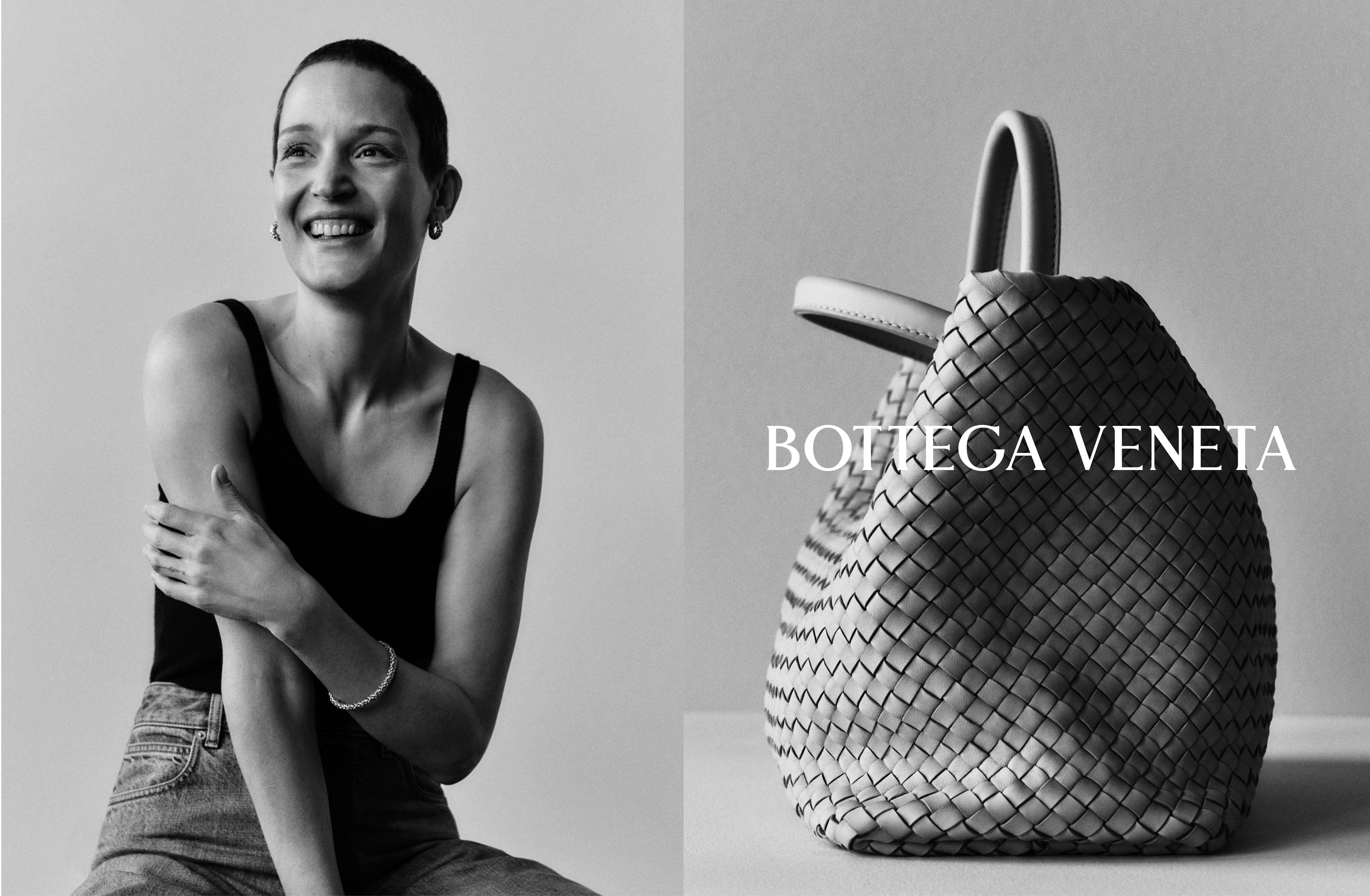 Black and white portrait of a smiling woman in a dark tank top next to a woven leather handbag with Bottega Veneta text.