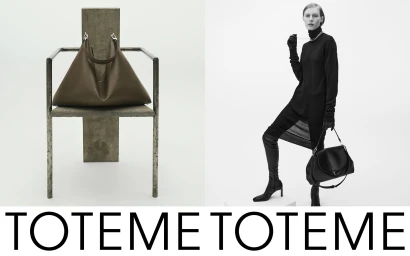 Model in black turtleneck and tall boots standing beside a sculptural metal chair holding a leather handbag against white