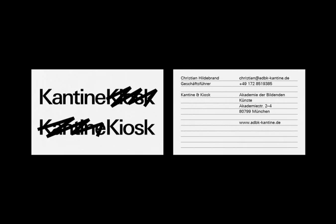 Two rectangular business cards with black typography on white paper set against a solid black background.