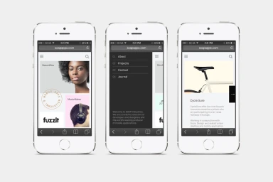 Three white smartphones displaying mobile website layouts and navigation menus against a clean background