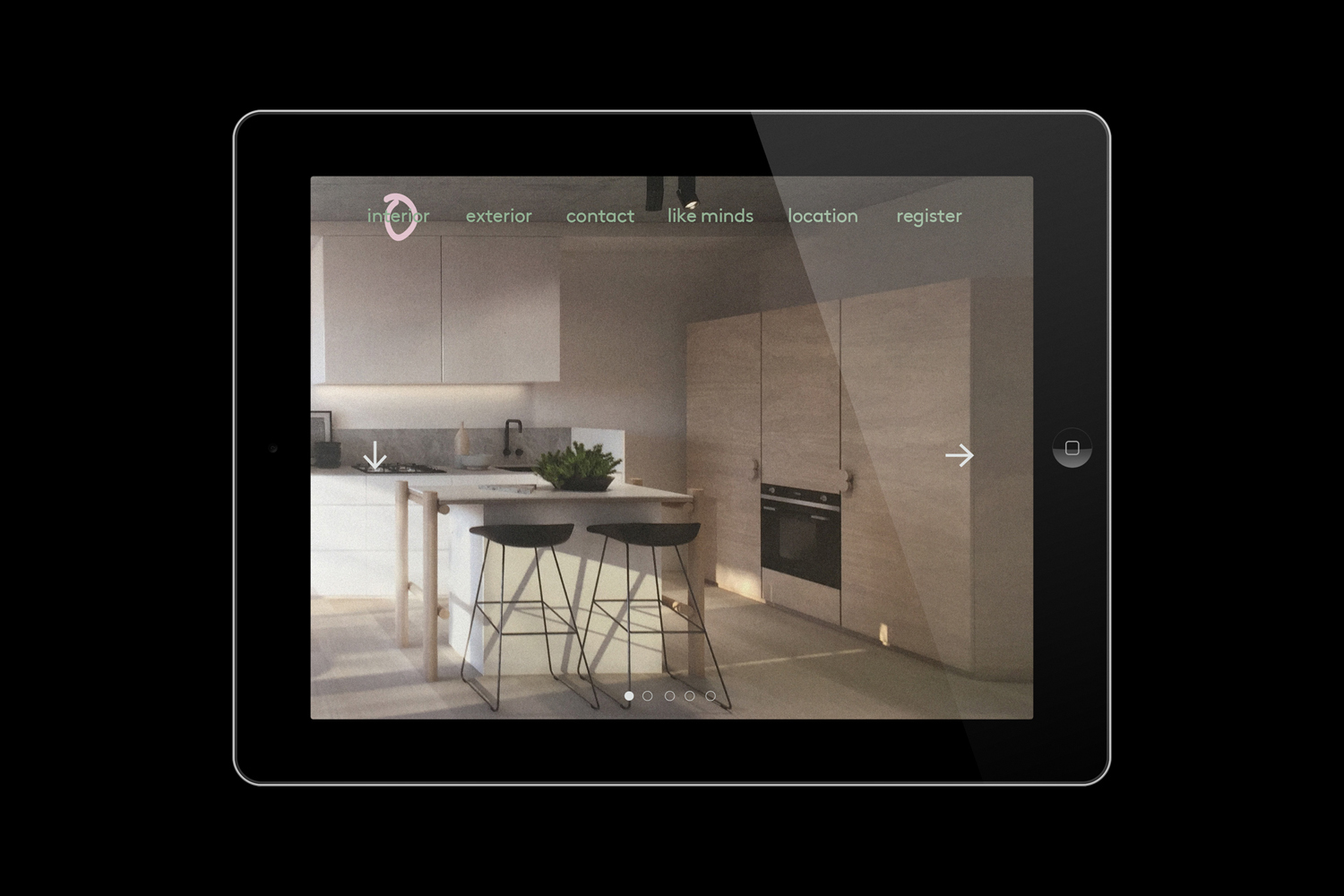 Tablet displaying a modern kitchen interior website design with navigation links and minimalist layout