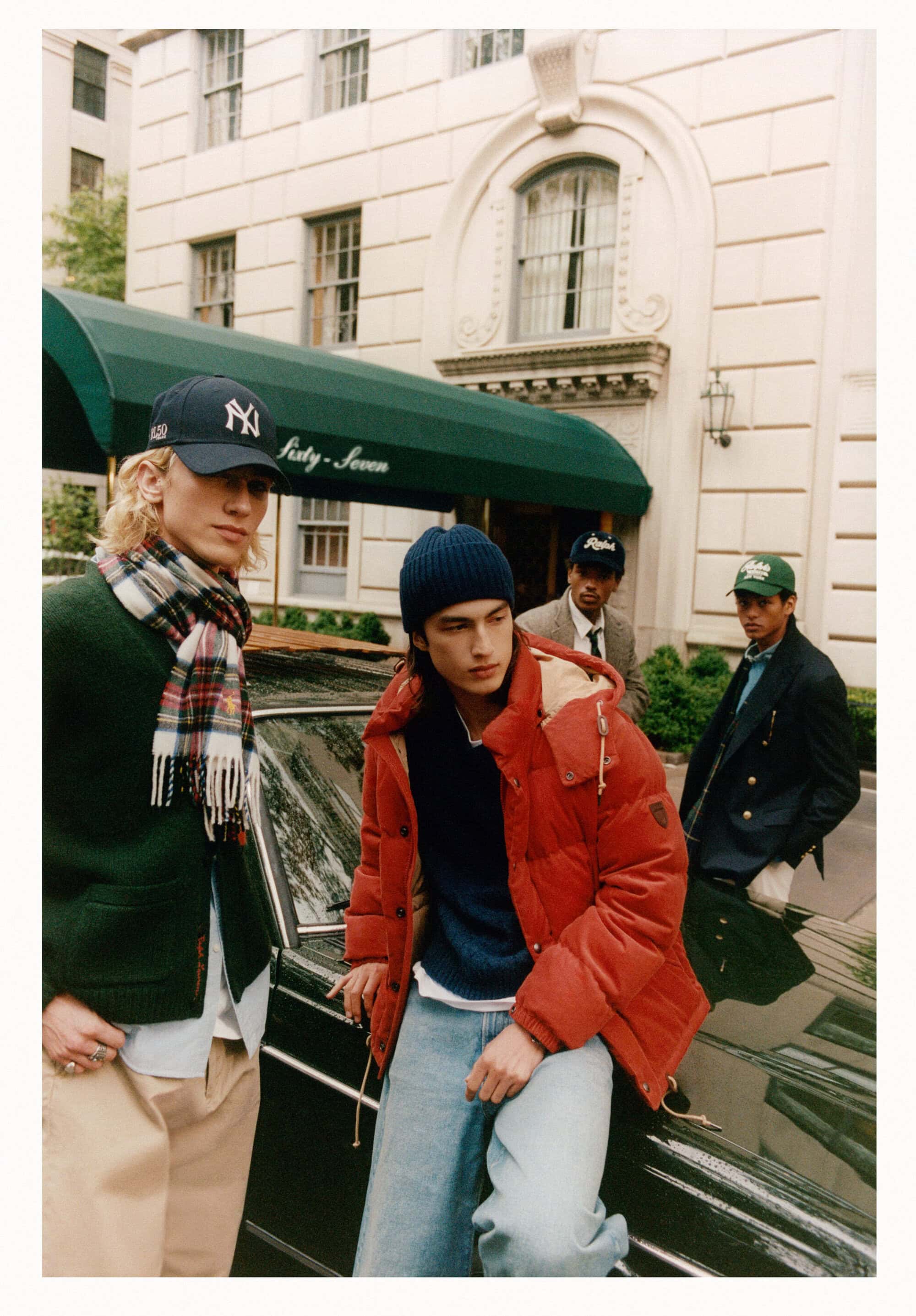 Four male models posing outside a classic New York building wearing winter apparel for Polo Ralph Lauren