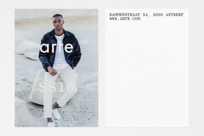 A black man seated on light stone wearing a dark jacket over a white t-shirt, with graphic text and white background panels.