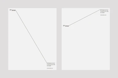 Minimalist stationery design featuring brand typography and diagonal accent lines on white paper