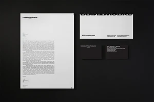Printworks London brand identity stationery set with letterhead, compliment slip, and business cards on a dark textured background