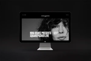 Desktop computer displaying the Printworks London website on a black background