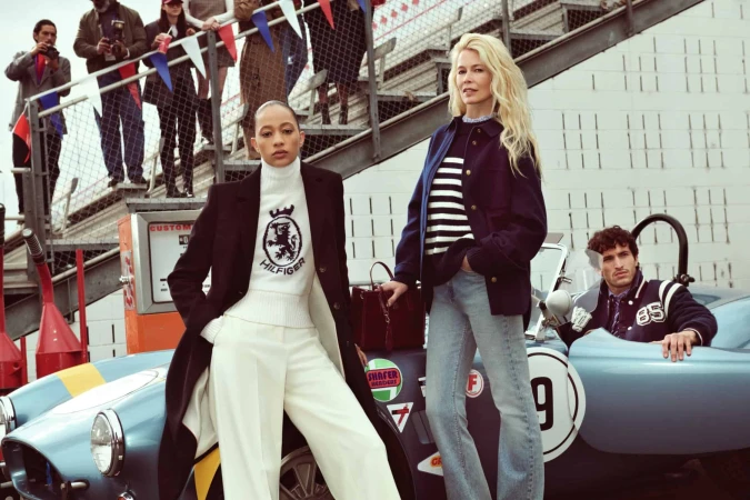 Claudia Schiffer and models posing with a vintage blue sports car for Tommy Hilfiger Fall 2025 ad campaign shot by Glen Luchford