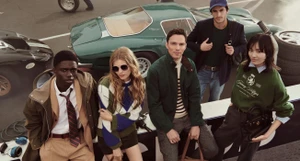 Group of diverse models posing together outdoors near vintage sports cars for a Tommy Hilfiger ad campaign photographed by Glen Luchford.